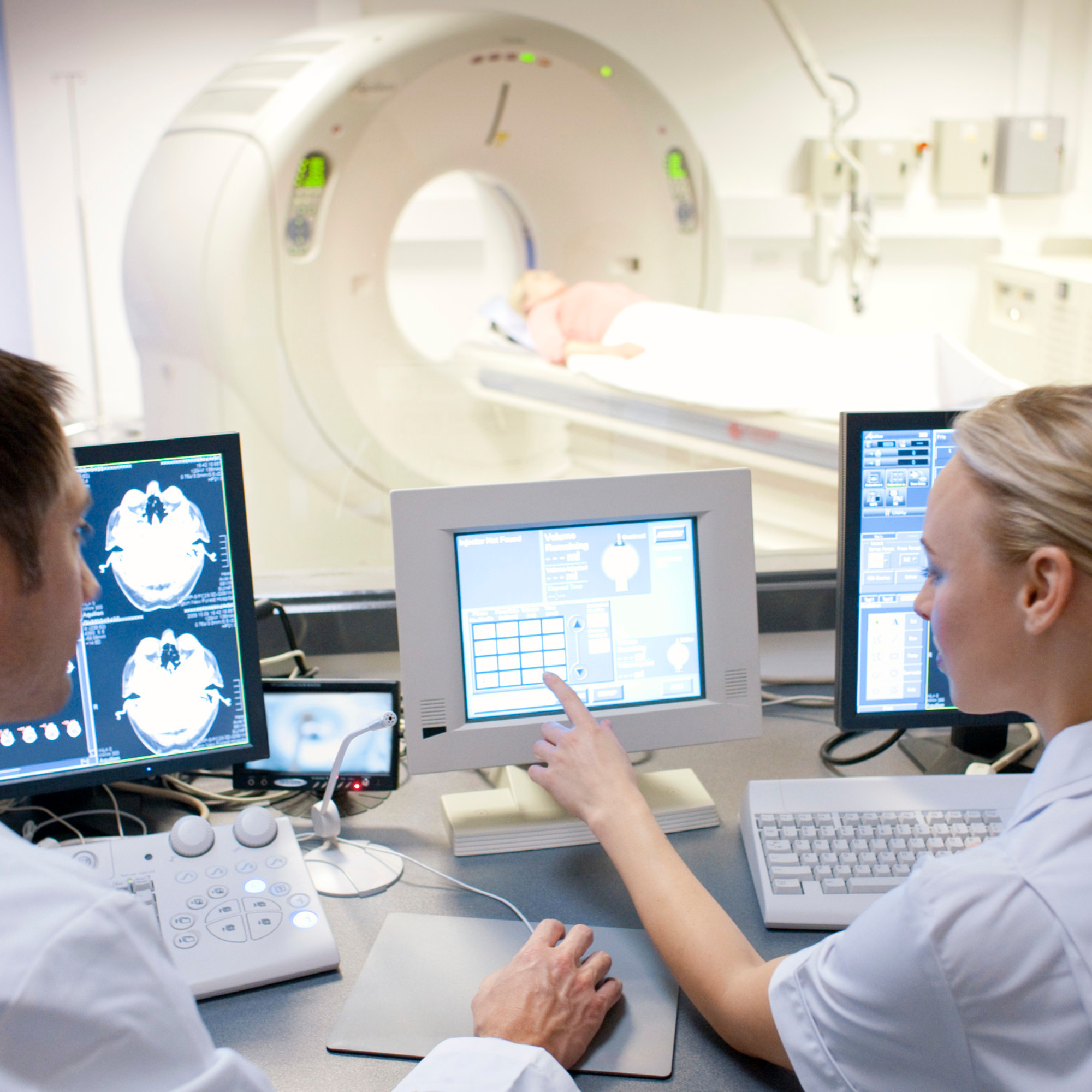 Medical radiation technologist supporting a patient during diagnostic imaging
