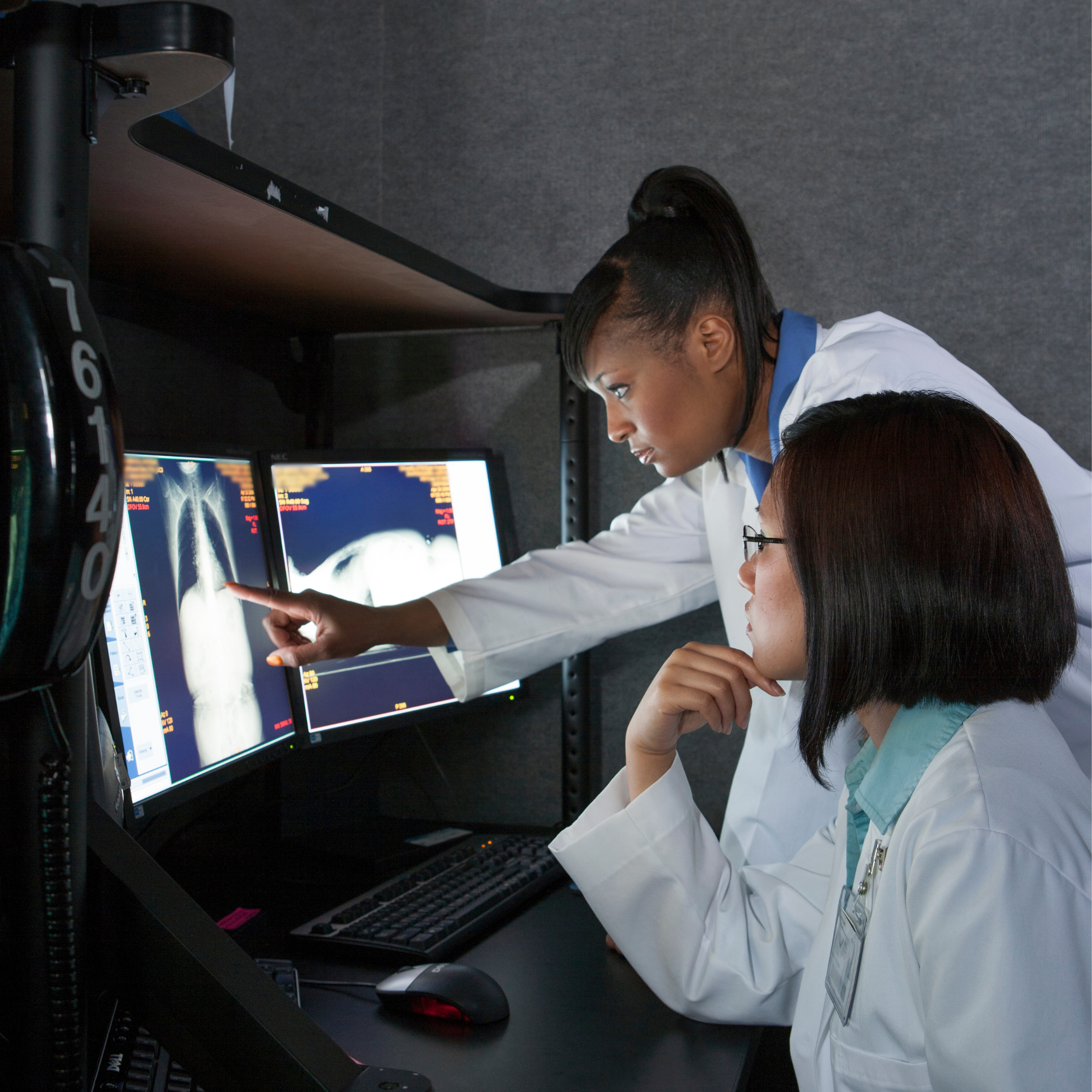 Medical radiation technologist supporting a patient during diagnostic imaging